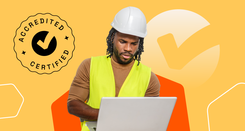 A hard-hatted worker in hi-vis taking an accredited Echo3 course on a laptop