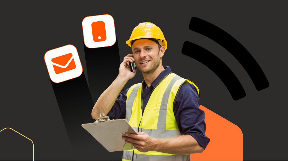 Site worker in a hard hat and hi-vis taking a phone call