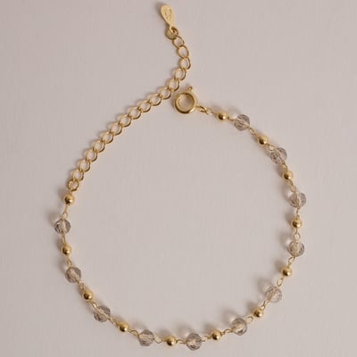 Pulseira entremeios cristais fumê e bolas 15cm com alongadora