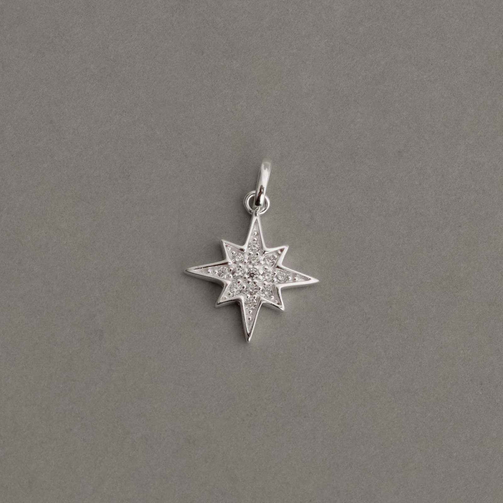 Pingente estrela 8 pontas cravejada 15mm