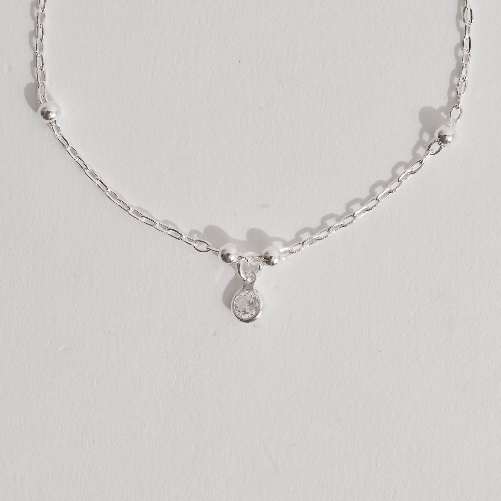 Pulseira infantil entremeio bolas 3mm e pingente zircônia 4mm 15cm