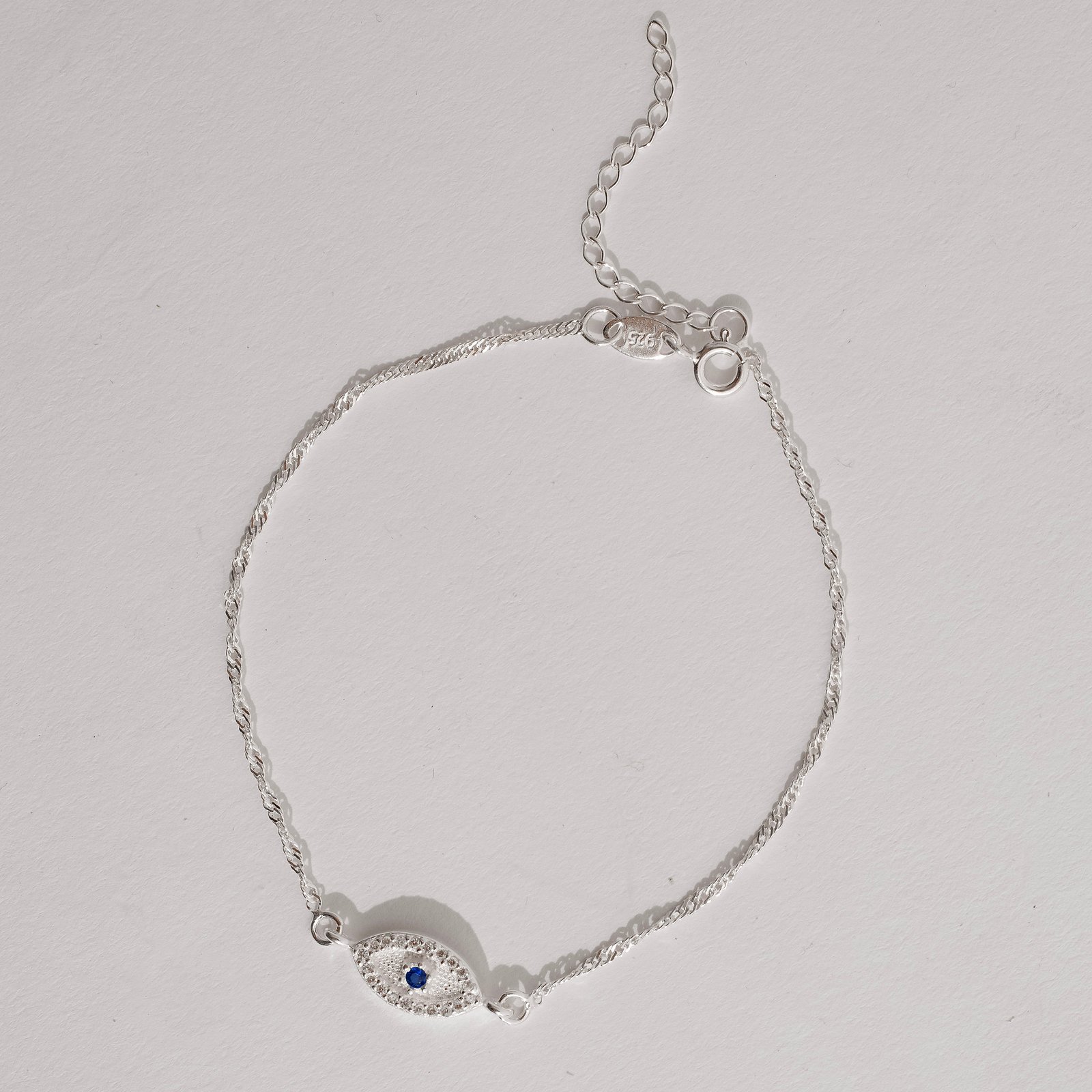 Pulseira entremeio olho grego cravejado 12mm corrente singapura