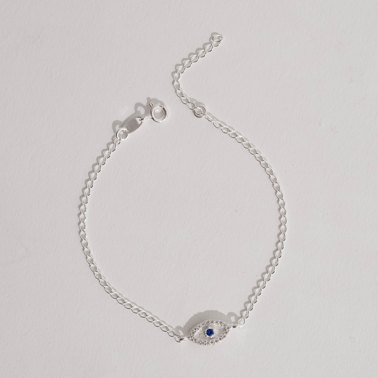 Pulseira entremeio olho cravejado detalhe zircônia azul 12mm