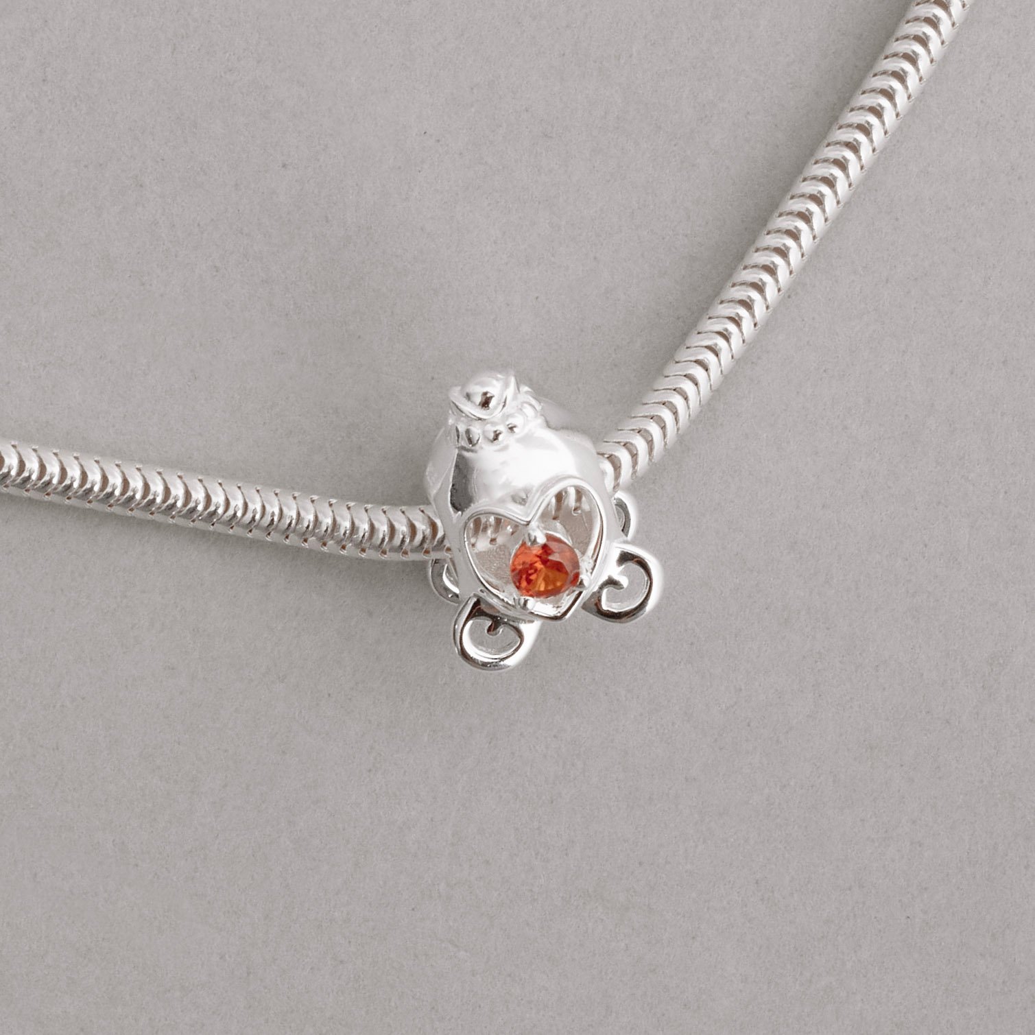 Berloque separador carruagem detalhe zircônia laranja 13mm