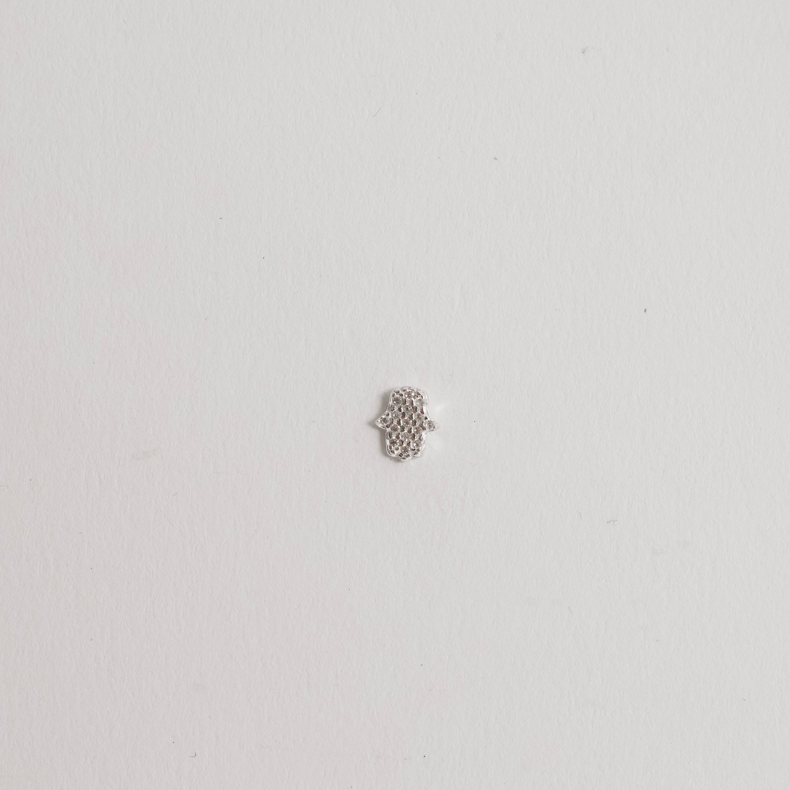 Piercing haste mão cravejada 7mm