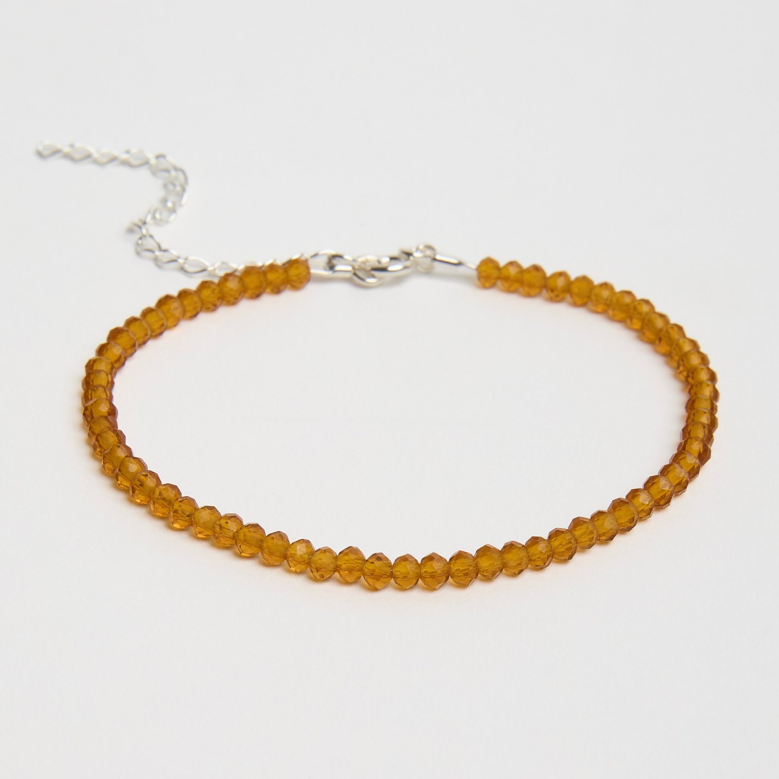 Pulseira cristal mostarda 3mm 16cm com alongadora