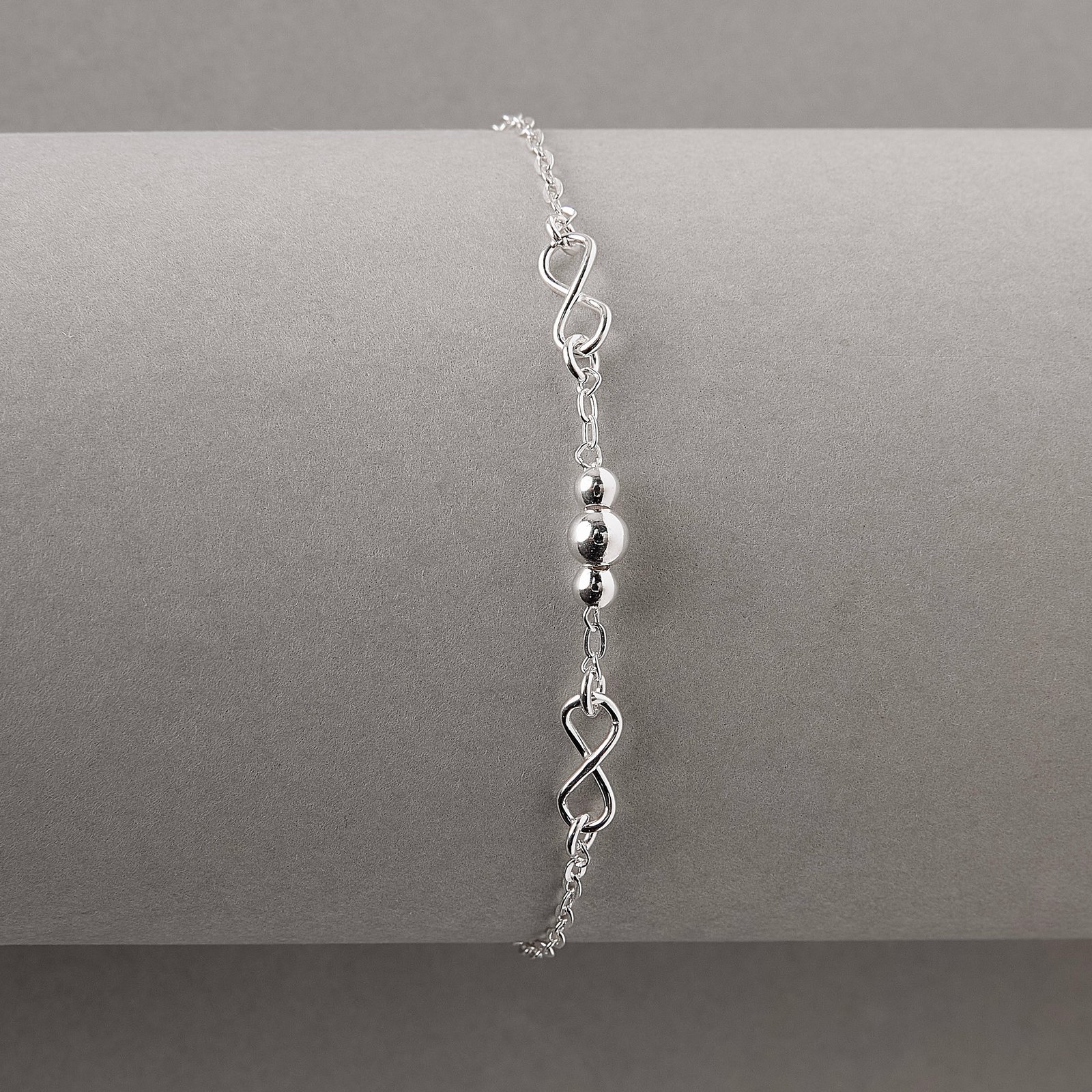 Imagem Secundária Pulseira infantil entremeios infinitos e bolas 13cm com alongadora