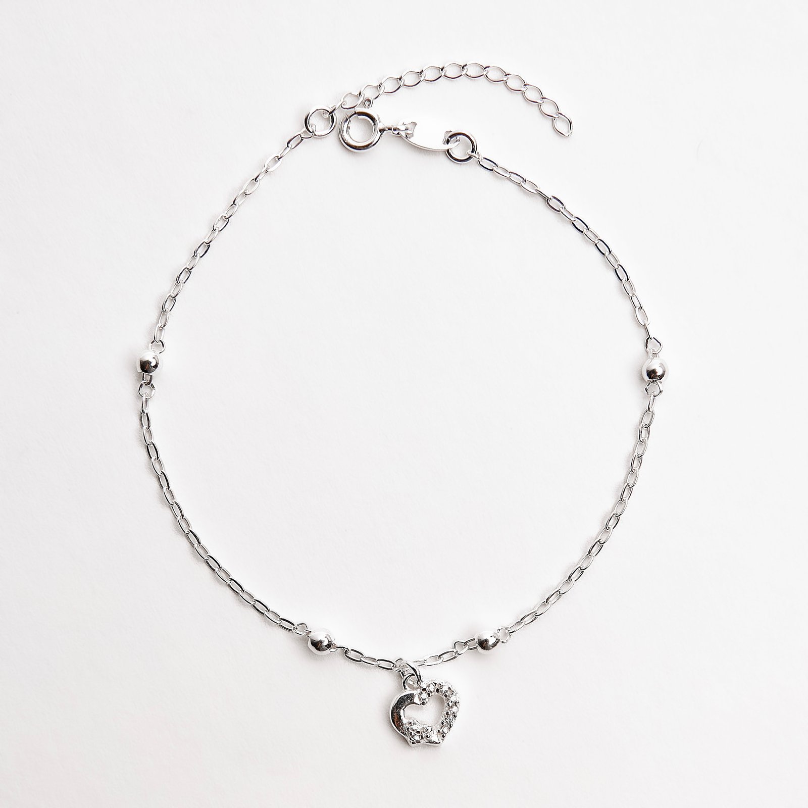 Imagem Pulseira entremeio bolas com pingente coração vazado cravejado 7mm 18+3cm