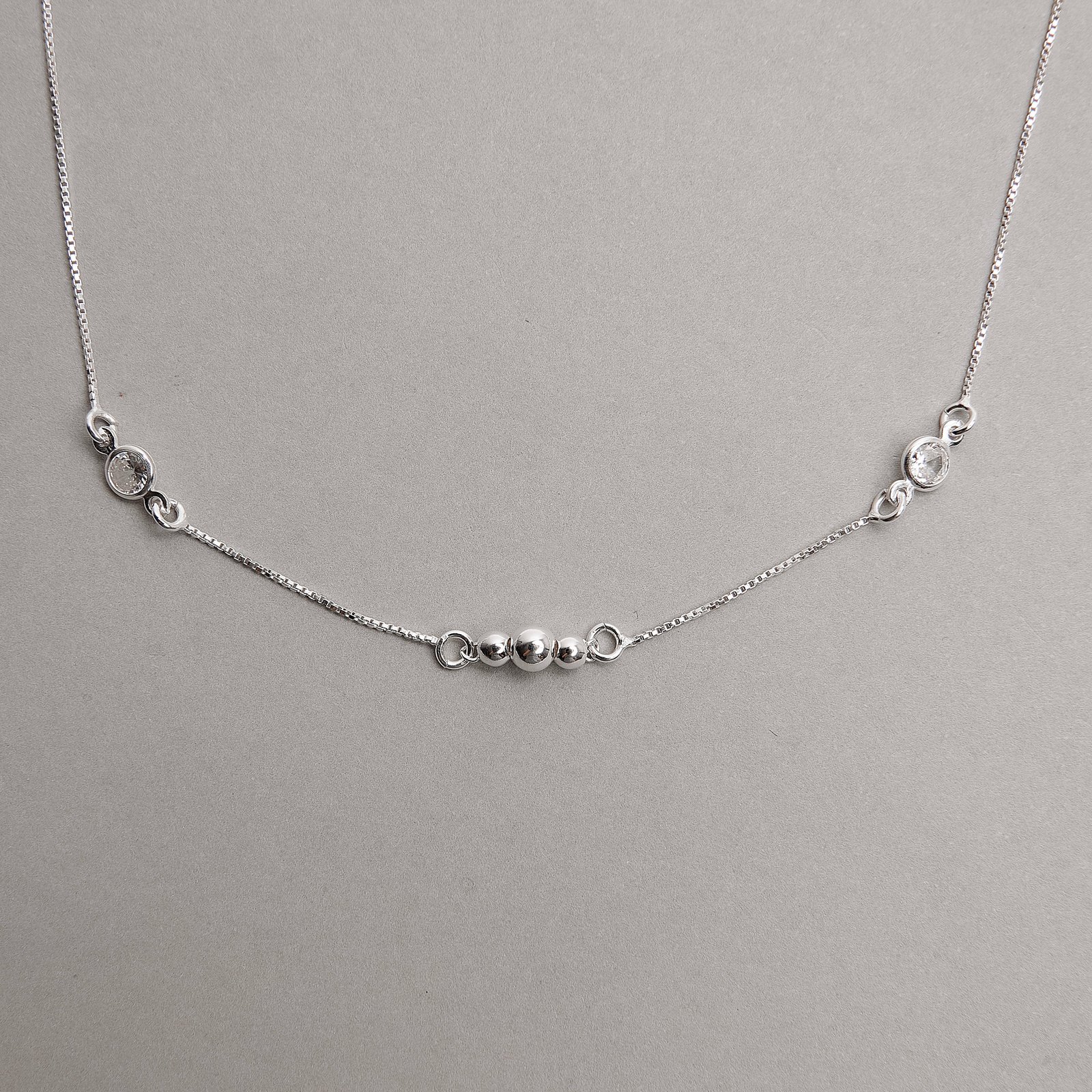 Pulseira entremeios zircônia e bolas 19+3cm