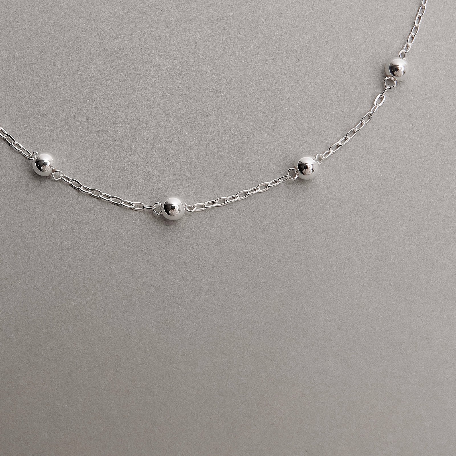 Pulseira infantil entremeio 5 bolas 4mm 13cm com alongadora