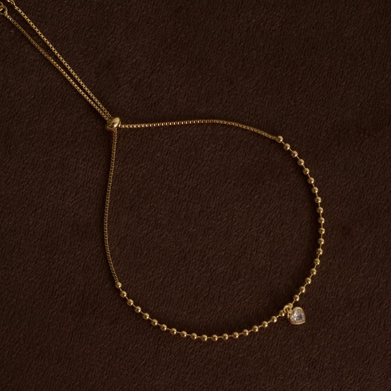 Pulseira entremeio bolas com pingente zircônia coração 5mm fecho regulável
