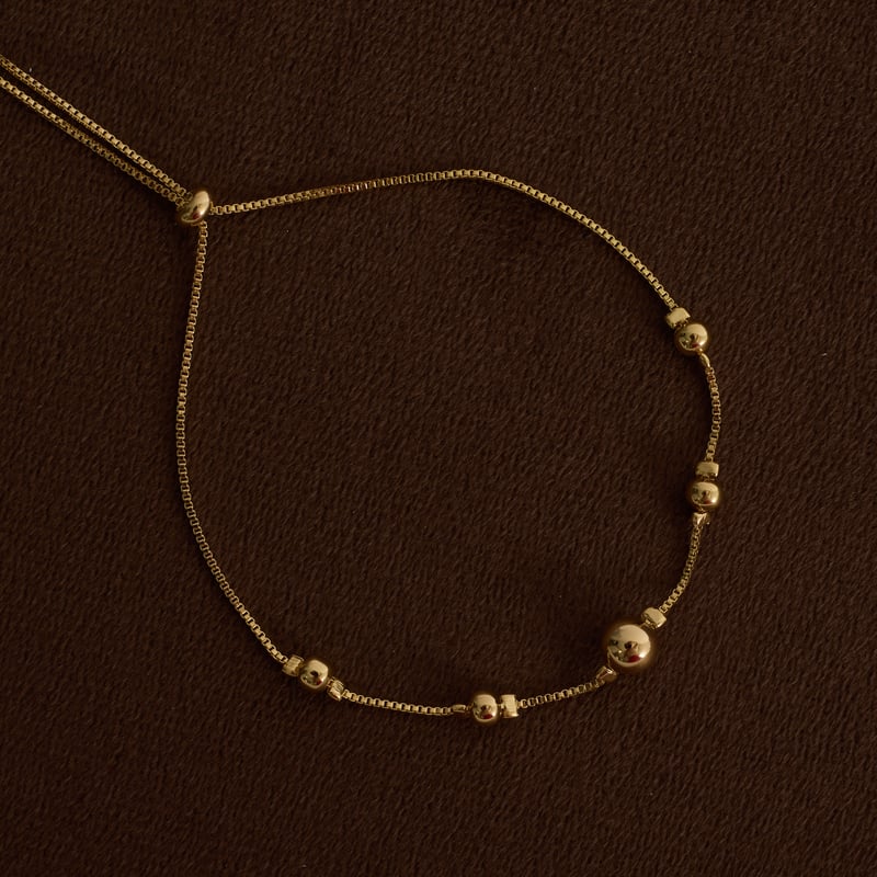 Pulseira entremeio bolas 4 e 6mm fecho regulável
