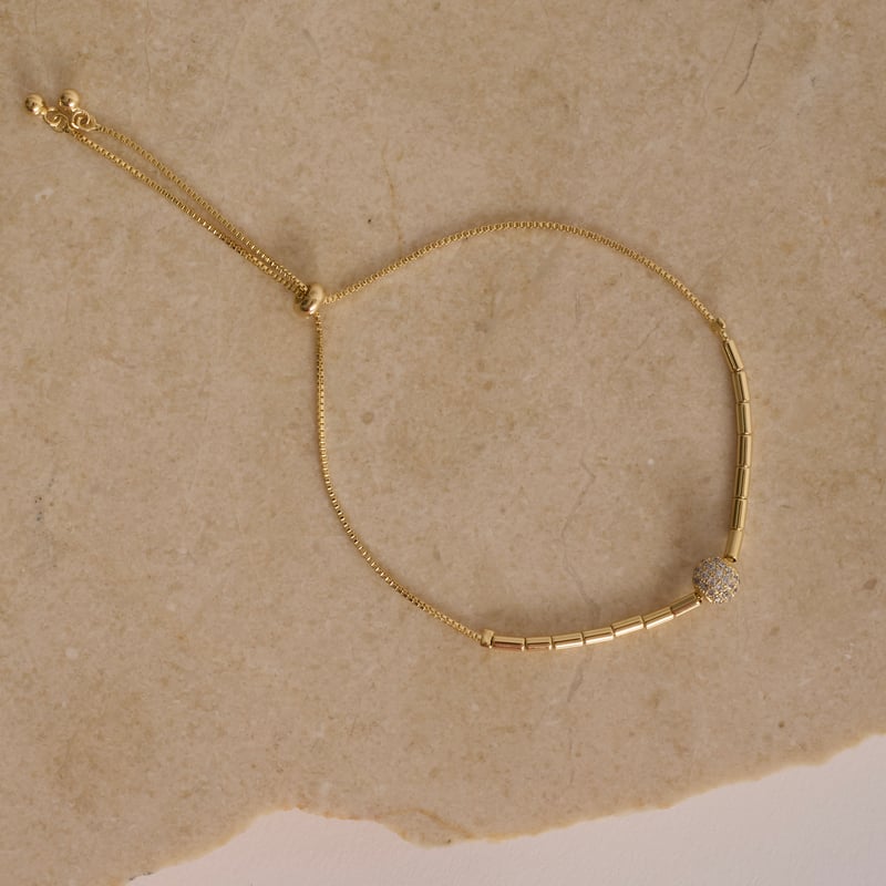 Pulseira entremeio canutilhos com bola cravejada 6mm fecho regulável