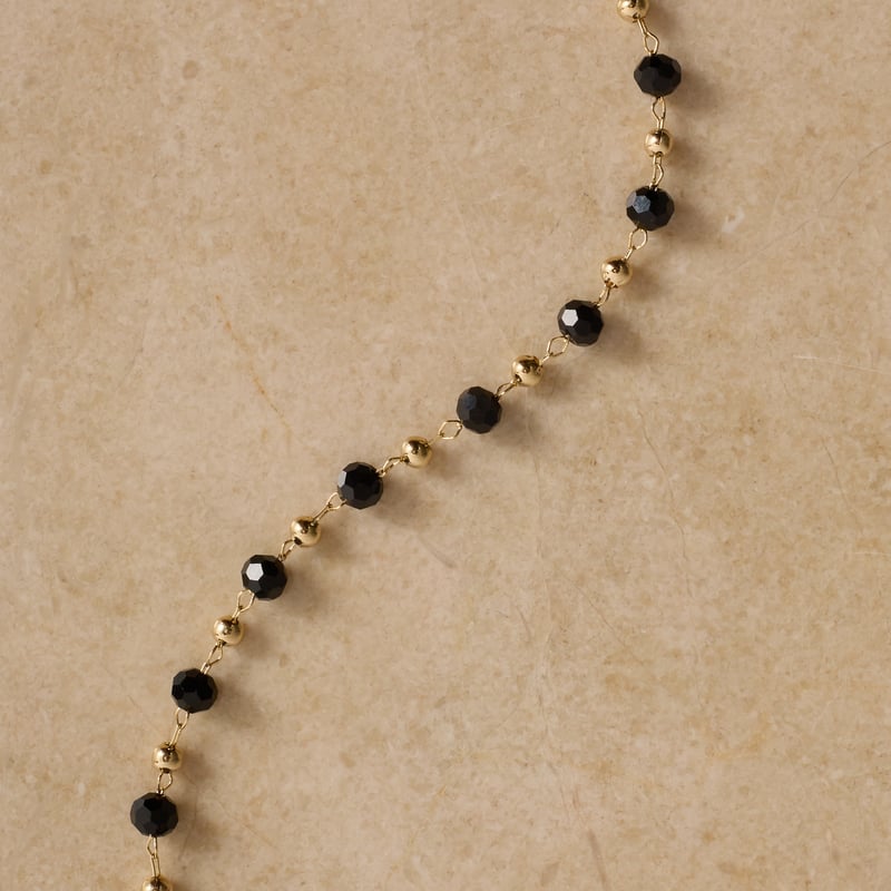 Pulseira entremeios cristais ônix e bolas 15cm com alongadora