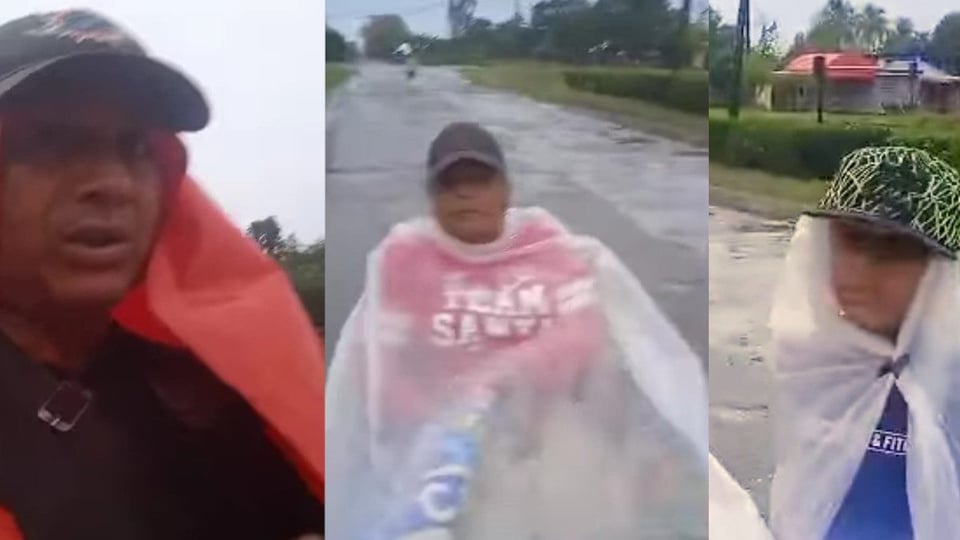 ¿Y la guagua? Cubano carga a su esposa en silla de ruedas bajo el aguacero por falta de transporte