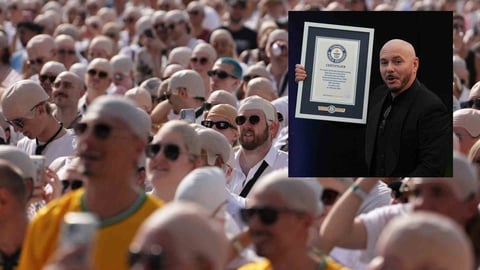 Pitbull rompe récord Guinness con miles de fanáticos calvos en Londres