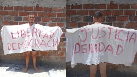 Joven de El Cobre protesta por libertad y justicia con sábana blanca