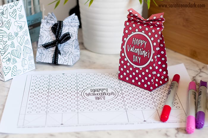 Valentines-Day-Gift-Box-Tutorial DIY Valentine's Day Paper Gift Bags | Free Template and Tutorial | Learn how to make your own cute coloring page paper gift bags - what a great gift idea for Valentine's Day! Watch the video instructions and download your free printable template at www.sarahrenaeclark.com| Valentine's Day Craft, DIY Valentine's Day, DIY paper gift bag, DIY gift bag, Valentine’s Day activity, DIY craft, free craft template, DIY gift bag tutorial, video tutorial, free template, free coloring page, free Valentine’s Day coloring pages, free printable, printable template