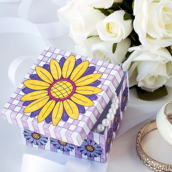 Make a paper gift box for Mother’s Day with this template and video tutorial by Sarah Renae Clark. There are 6 different designs to color in! What a great DIY Mother’s Day gift| Find more Mother’s Day printables and coloring pages at https://sarahrenaeclark.com/shop/cat/seasonal/mothers-day/