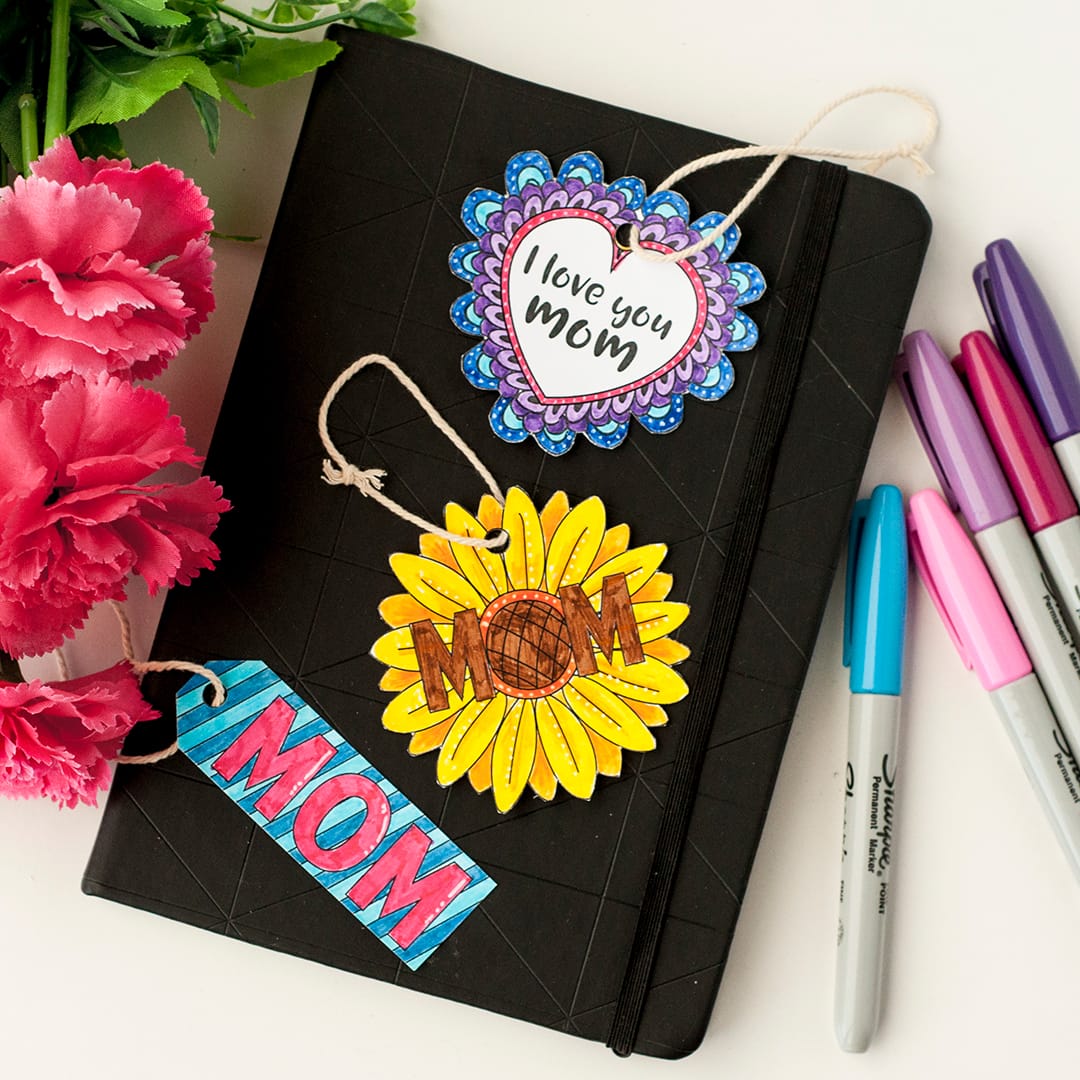 Create some coloring page gift tags | Click to see all 29 creative ways to repurpose your coloring pages | #coloringpage #crafts www.sarahrenaeclark.com