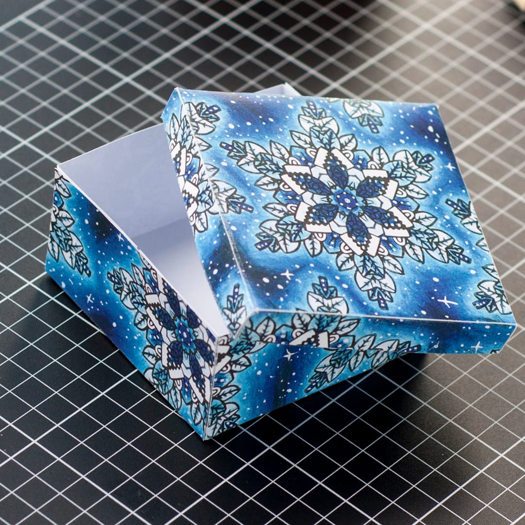 Make a paper gift box for Christmas with this template and tutorial by Sarah Renae Clark. There are 6 different designs to color in! What a great DIY Christmas gift
