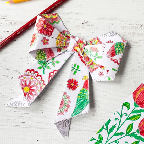 Turn yoru coloring pages into origami bows | Click to see all 29 creative ways to repurpose your coloring pages | #coloringpage #crafts www.sarahrenaeclark.com