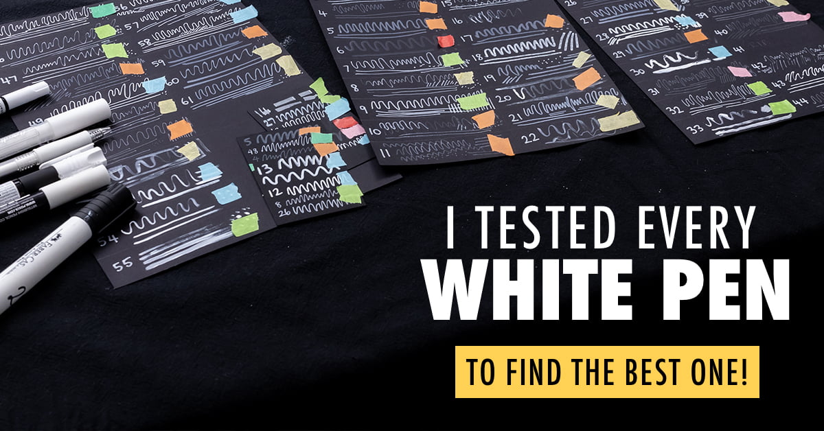 A collection of white pens and colorful swatches on black paper.