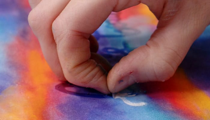 Peeling masking marker from coloring page