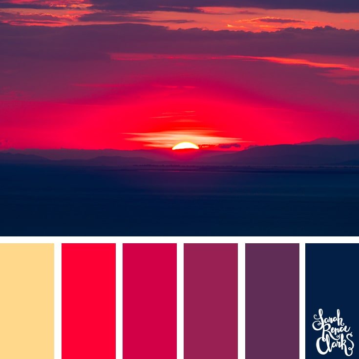 Color Palette 424 - a vivid read and purple sunset sky, fading centrally over a mountain range on the horizon. 