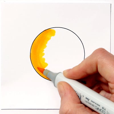 use lighter colours over your darker colours to create a blend using copic alcohol markers.