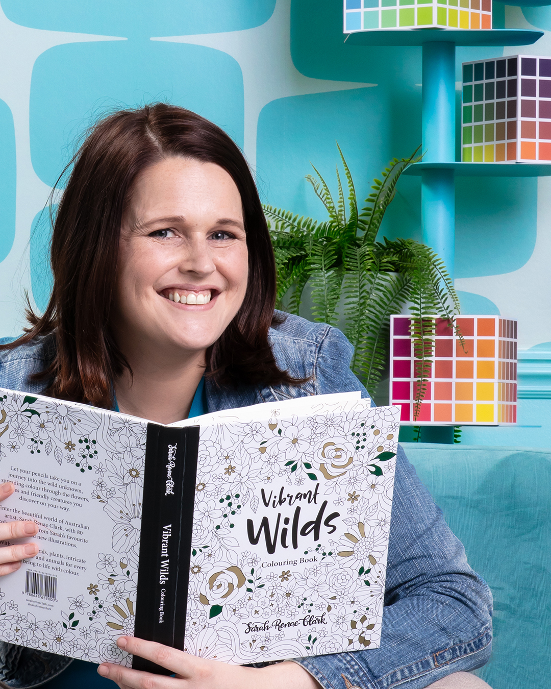 sara-renae-clark-photo Sarah Renae Clark with the Vibrant Wilds adult colouring book