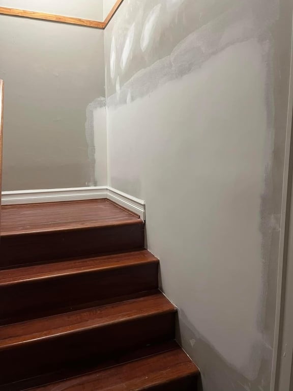Drywall repair on the stairs