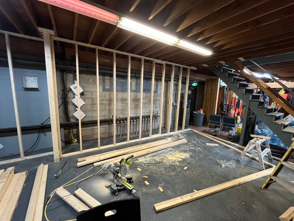 Basement renovation with recessed lighting and drywall