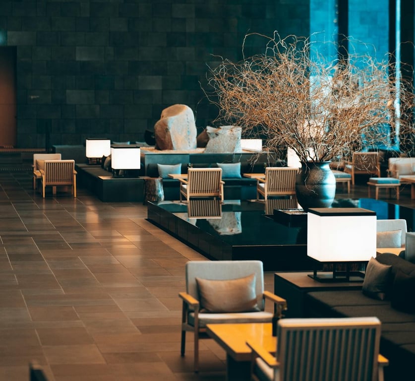 Warmly lit upscale lobby with lounge seating after hours