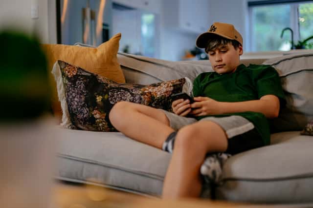Kid on the couch with phone