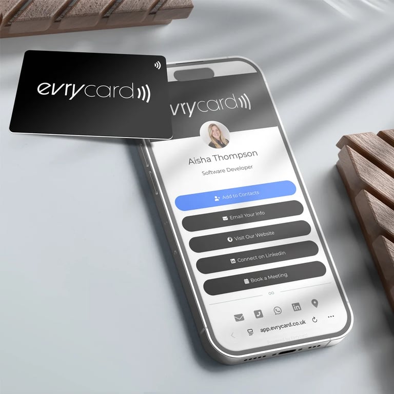 Mobile phone showing a digital business card profile on screen.