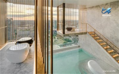 Private dipping pool with seating areas and panoramic city views