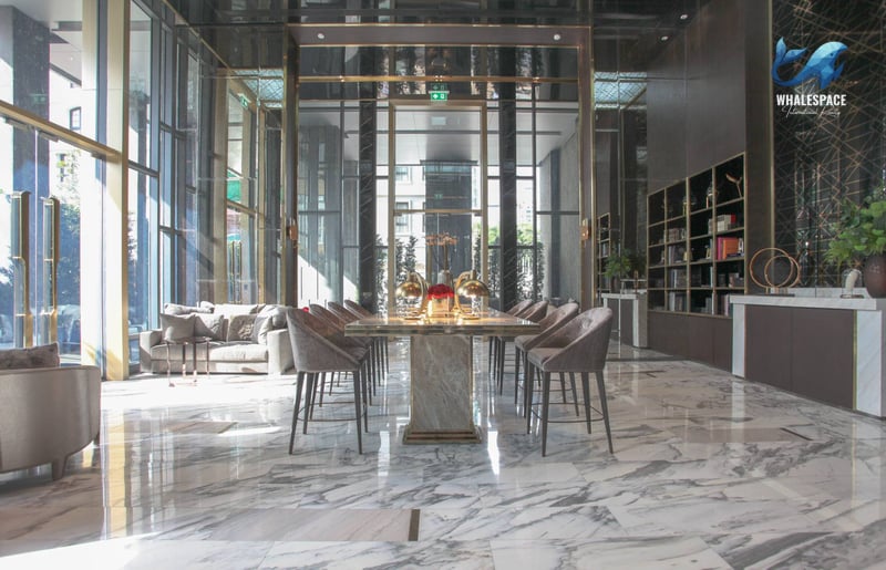 Elegant communal dining area with marble flooring and luxurious seating