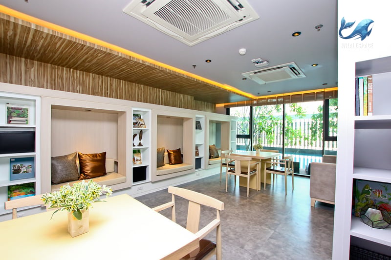 Comfortable resident's lounge with ample seating, study nooks, and natural light.