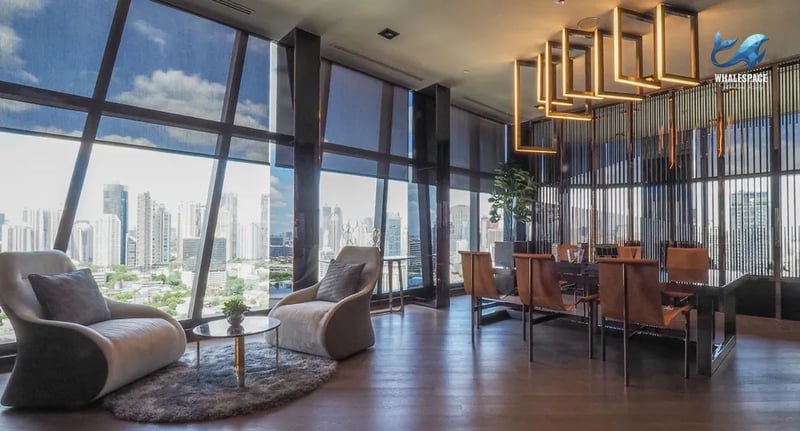 Elegant lounge area with stylish seating and panoramic city views.