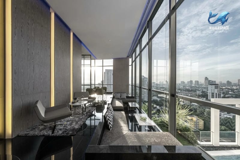Elegant lounge with panoramic city views and plush seating