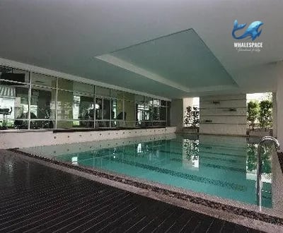 Indoor swimming pool with a distinct rectangle of light on the ceiling.