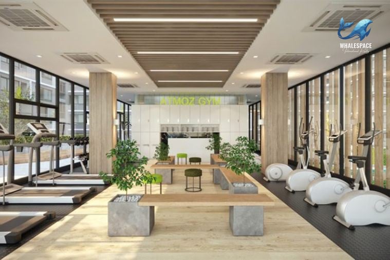 Well-equipped fitness center with cardio machines and weights
