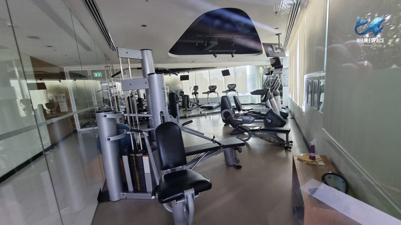 Well-equipped indoor fitness center with cardio and weight machines