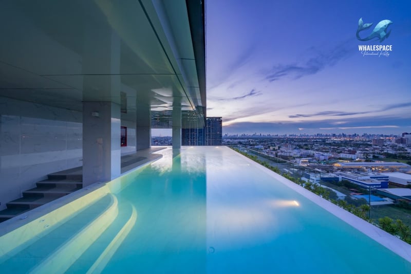 Infinity sky pool overlooking the city at dusk