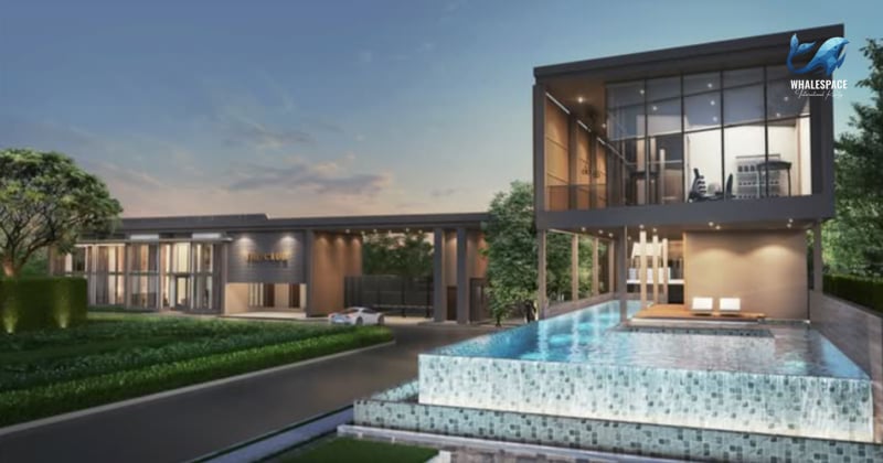 Modern architectural entrance with a water feature and a luxury car parked outside