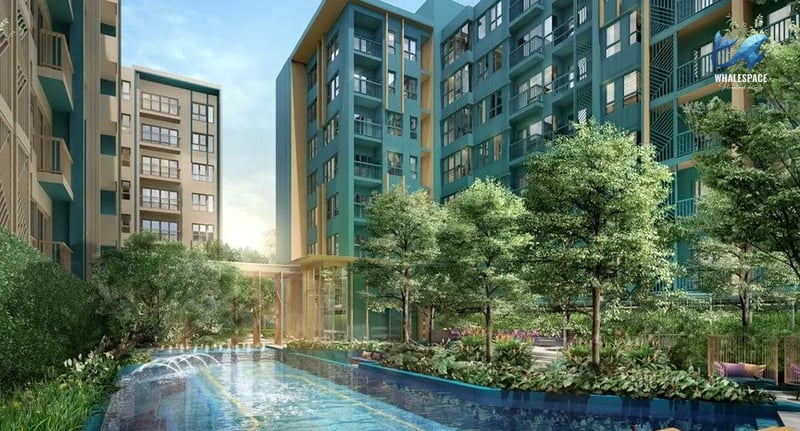 Modern residential buildings with lush greenery and a serene water feature