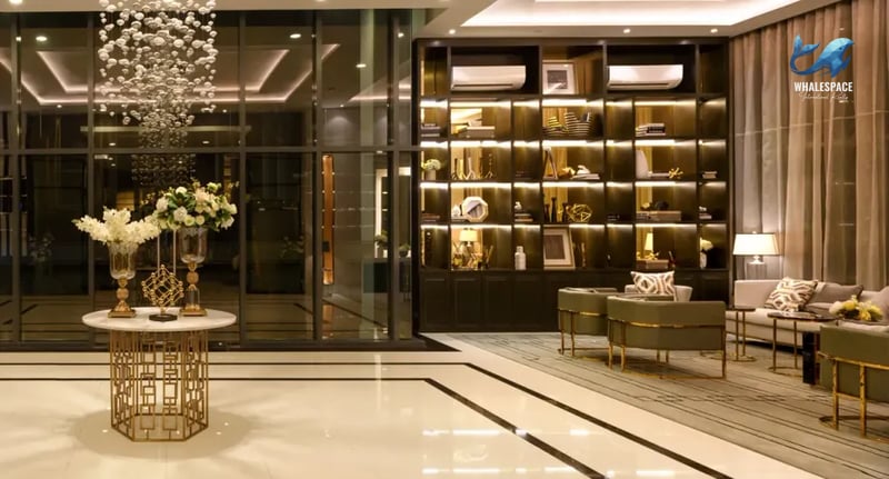 Elegant lounge area with stylish seating, a decorative bookshelf wall, and ambient lighting.