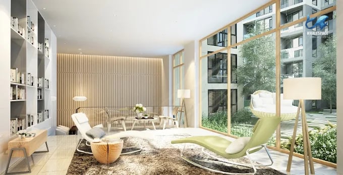 Elegant lounge area with modern furniture and large windows offering green views