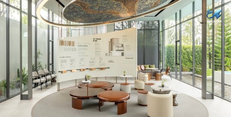 Elegant lobby area featuring stylish furniture, natural light, and informative displays.